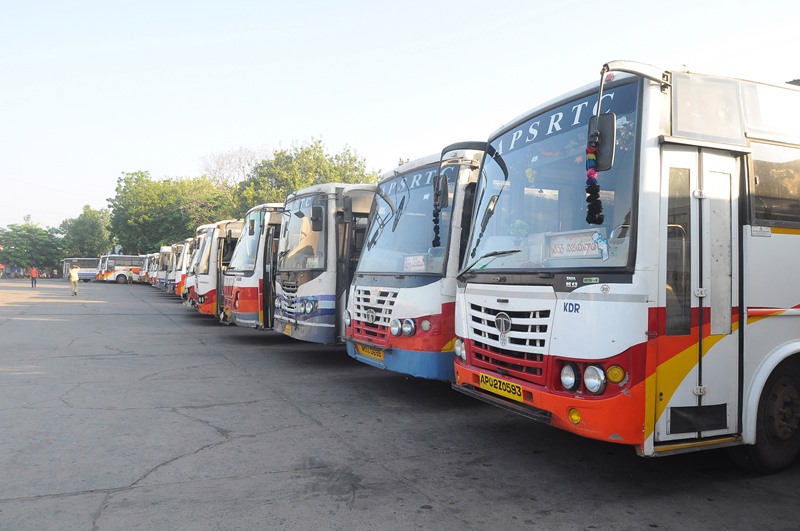 Commuters on their way to board the buses during Bharat Bandh in Vijayawada