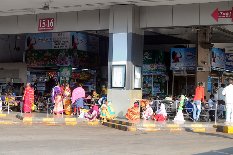 Commuters on their way to board the buses during Bharat Bandh in Vijayawada