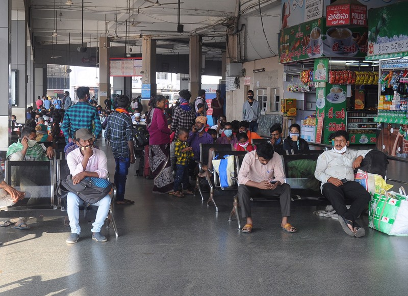 Commuters on their way to board the buses during Bharat Bandh in Vijayawada