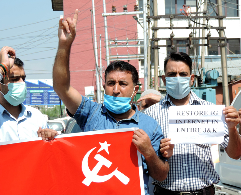 CPI(M) activists agitate demanding withdrawal of cases against party General Secretary Sitaram Yechury