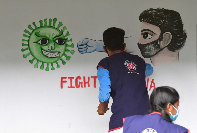 Students create awareness on COVID19 by painting on school wall