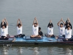 Students of a Water Club perform Yoga