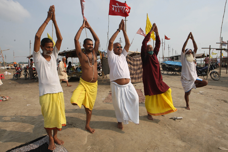 Devotees performing Yoga on the occasion of International Yoga Day