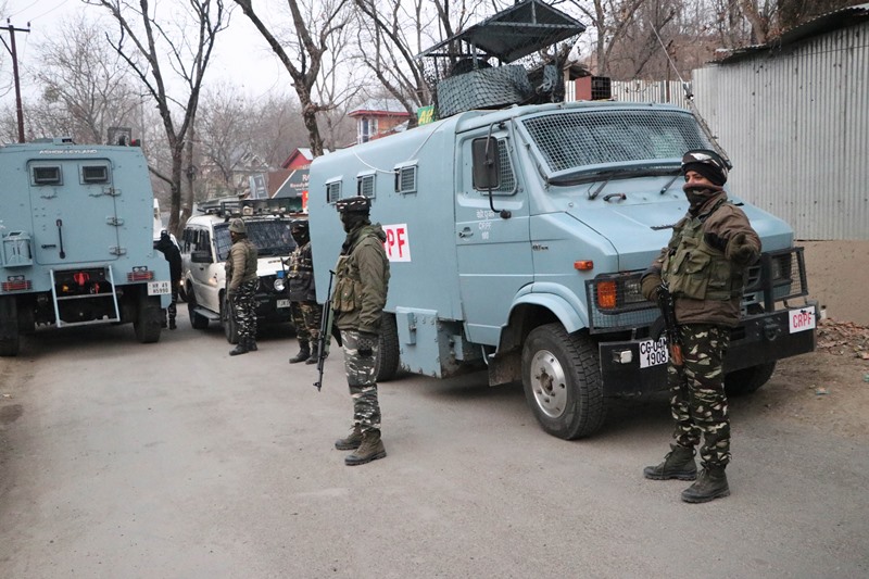 Security personnel takes position during encounter with terrorists in J&K's Pulwama