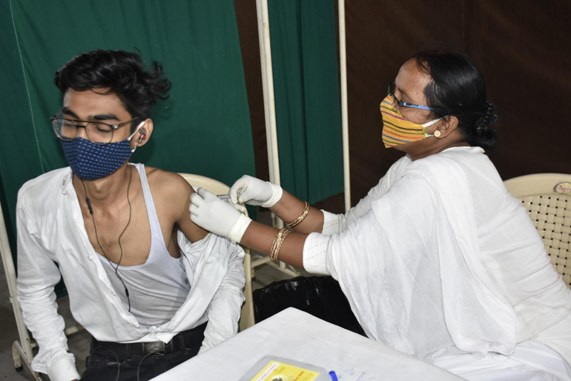 A young man gets Covid-19 vaccine in Patna