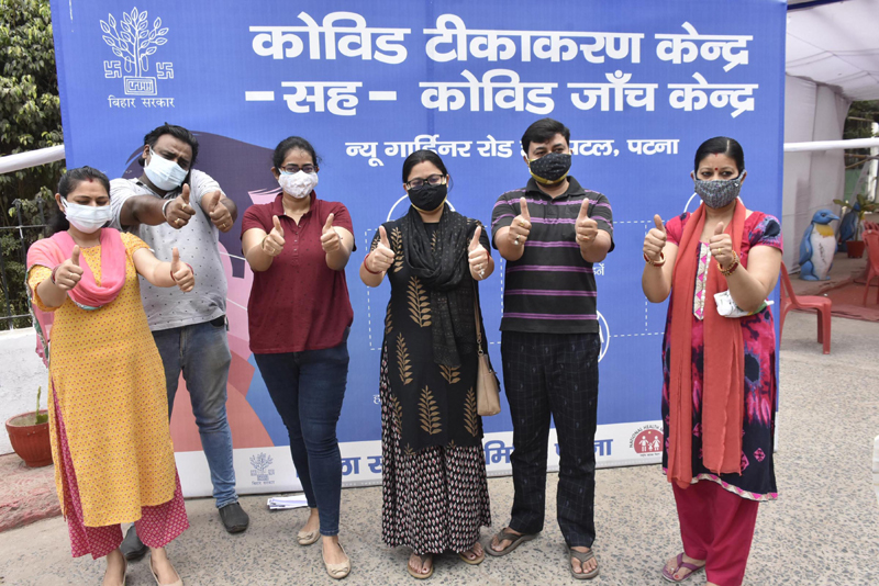 Youth celebrating after taking first dose of COVID-19 vaccine