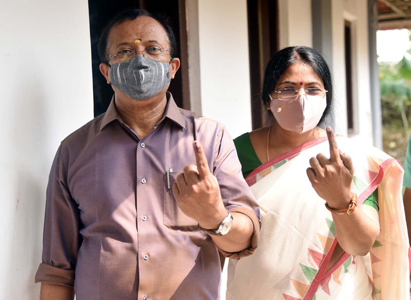 Union Minister V Muraleedharan and his wife cast votes in Kerala polls