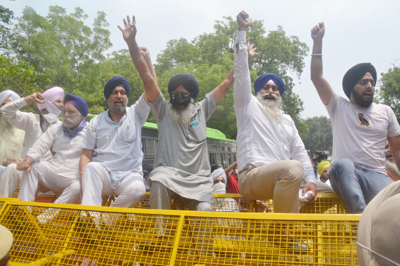 Members of Jago Party staging a protest outside Jammu and Kashmir House