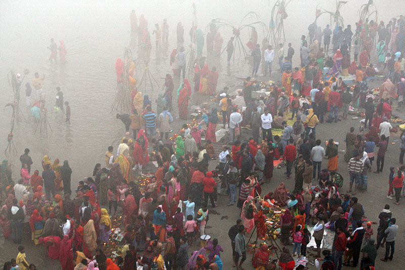 Chhath devotees worshipping the rising sun in Prayagraj