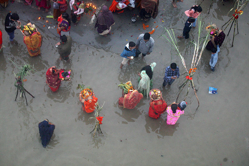 Chhath devotees worshipping the rising sun in Prayagraj