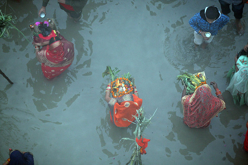 Chhath devotees worshipping the rising sun in Prayagraj