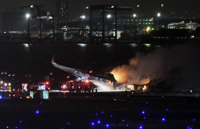 Japan Airlines flight catches fire after landing at Tokyo's Haneda Airport