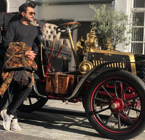 Anil Kapoor poses infront of a vintage car in London