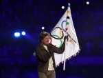 Tom Cruise dives into Paris Olympics closing event in a Mission Impossible-styled stunt, carries games' flag to LA