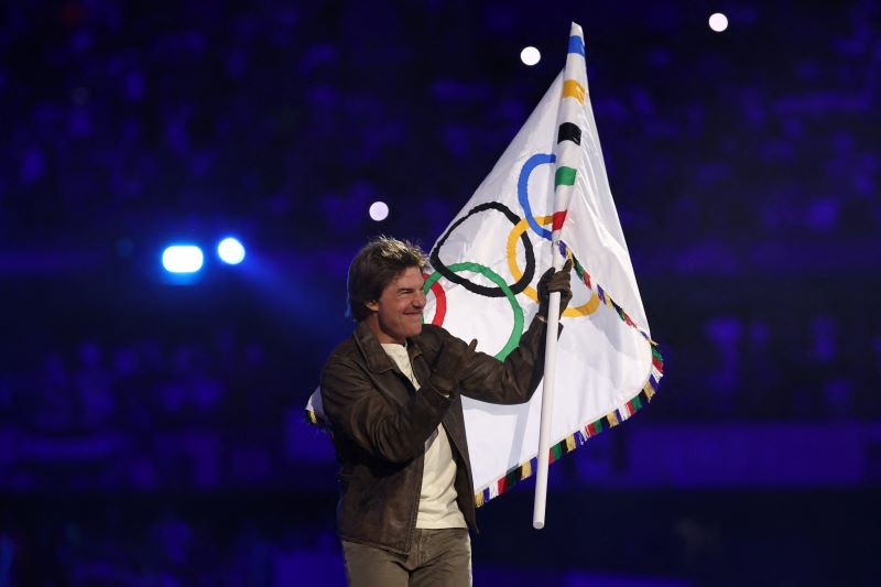 Tom Cruise dives into Paris Olympics closing event in a Mission Impossible-styled stunt, carries games' flag to LA