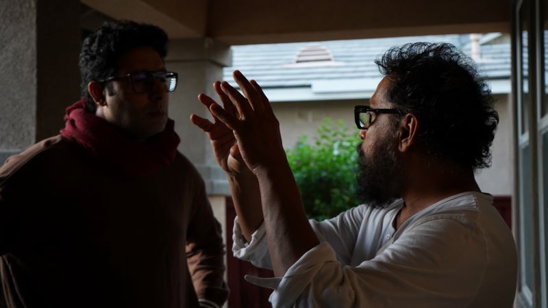 Abhishek Bachchan (L) with Shoojit Sircar (R) during shooting of I Want To Talk 