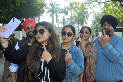 Punjab polls: People wait in queue to cast their votes