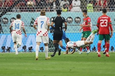 Achraf Dari of Morocco celebrates his goal with teammates during third place play-off match