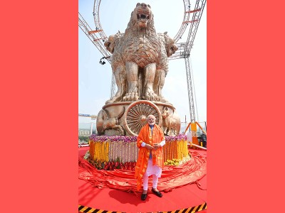 PM Modi unveils National emblem cast on new Parliament building