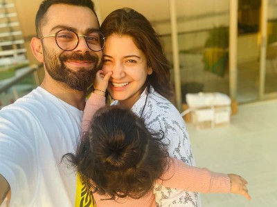 Caught off guard: Virat Kohli, Anushka Sharma after daughter Vamika's picture flashed on TV screens