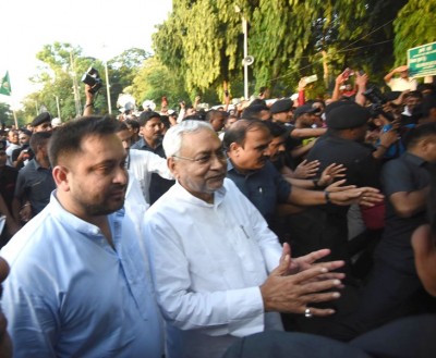 Nitish Kumar along with Tejashwi Yadav outside Raj Bhawan in Patna