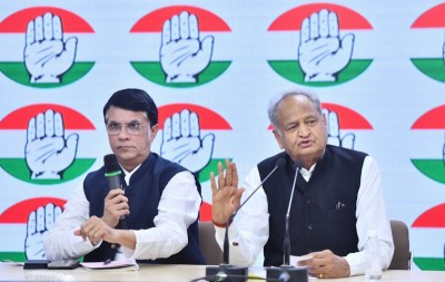 Rajasthan CM Ashok Gehlot addresses a press conference with Cong leader Pawan Khera