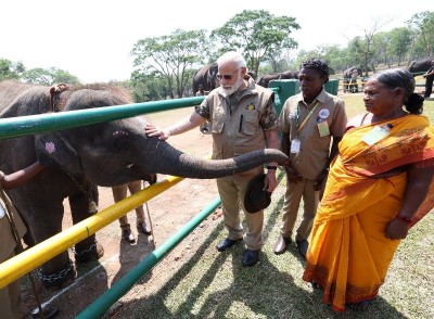 PM Modi meets  Bomman and Bellie, stars of Oscar-winning documentary 'The Elephant Whisperers' in Mudumalai Tiger Reserve