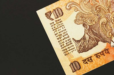 Indian Rupee improves 3 paise against USD