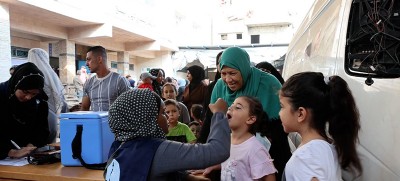 Between fear and hope, parents in Gaza line up to protect their children from polio amid Israel-Hamas conflict