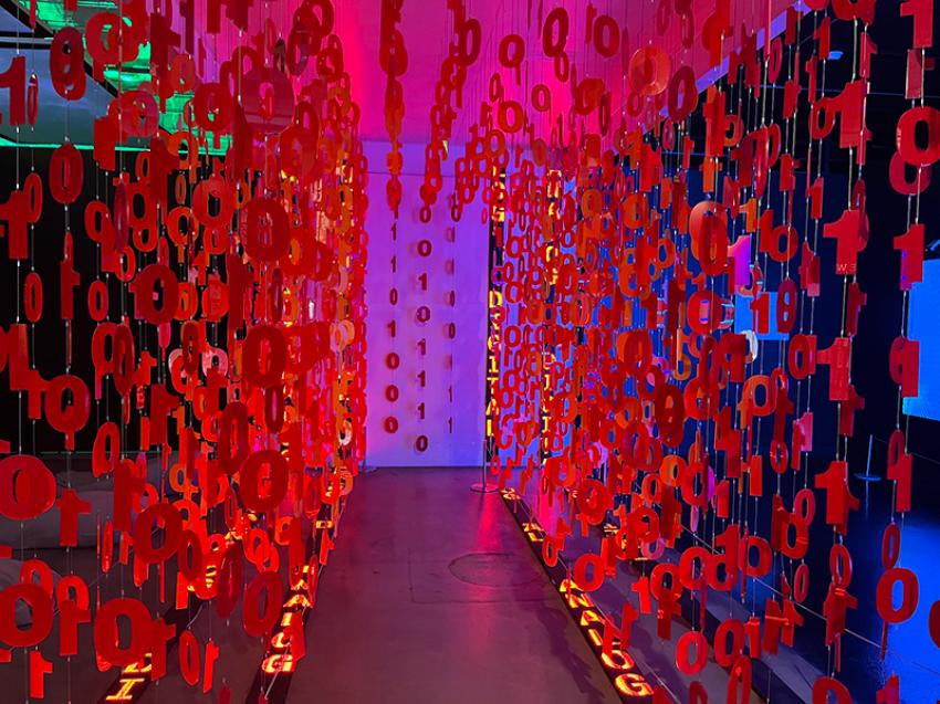 The strings of 0s and 1s hanging like curtains in bright red creates a psychedelic artspace. Photo: Sujoy Dhar