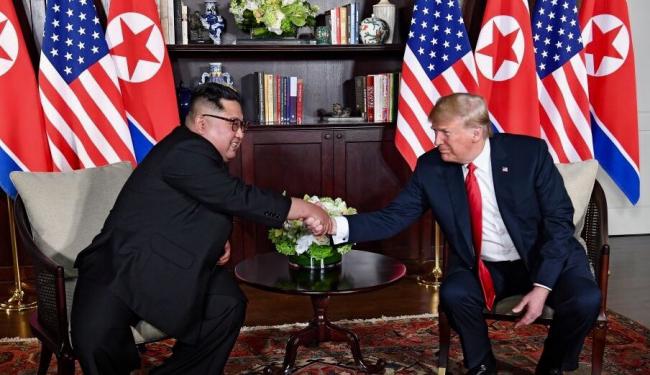 Trump pledges to end war games, Kim commits to denuclearization