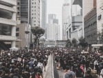 Hong Kong police use tear gas to disperse protesters in Mong Kok district - Reports