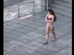 Iranian woman strips down to underwear at university in protest against hijab mandate