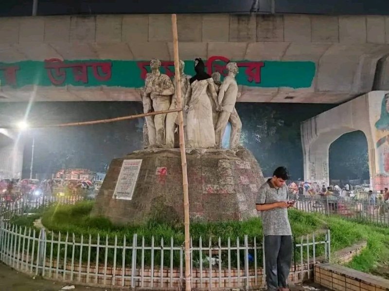 Unidentified men put 'hijab' on female statue at Dhaka University